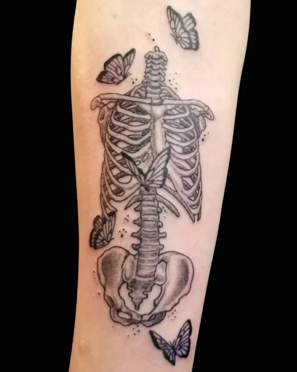 Fine line skeleton and butterflies tattoo by Josh Standley