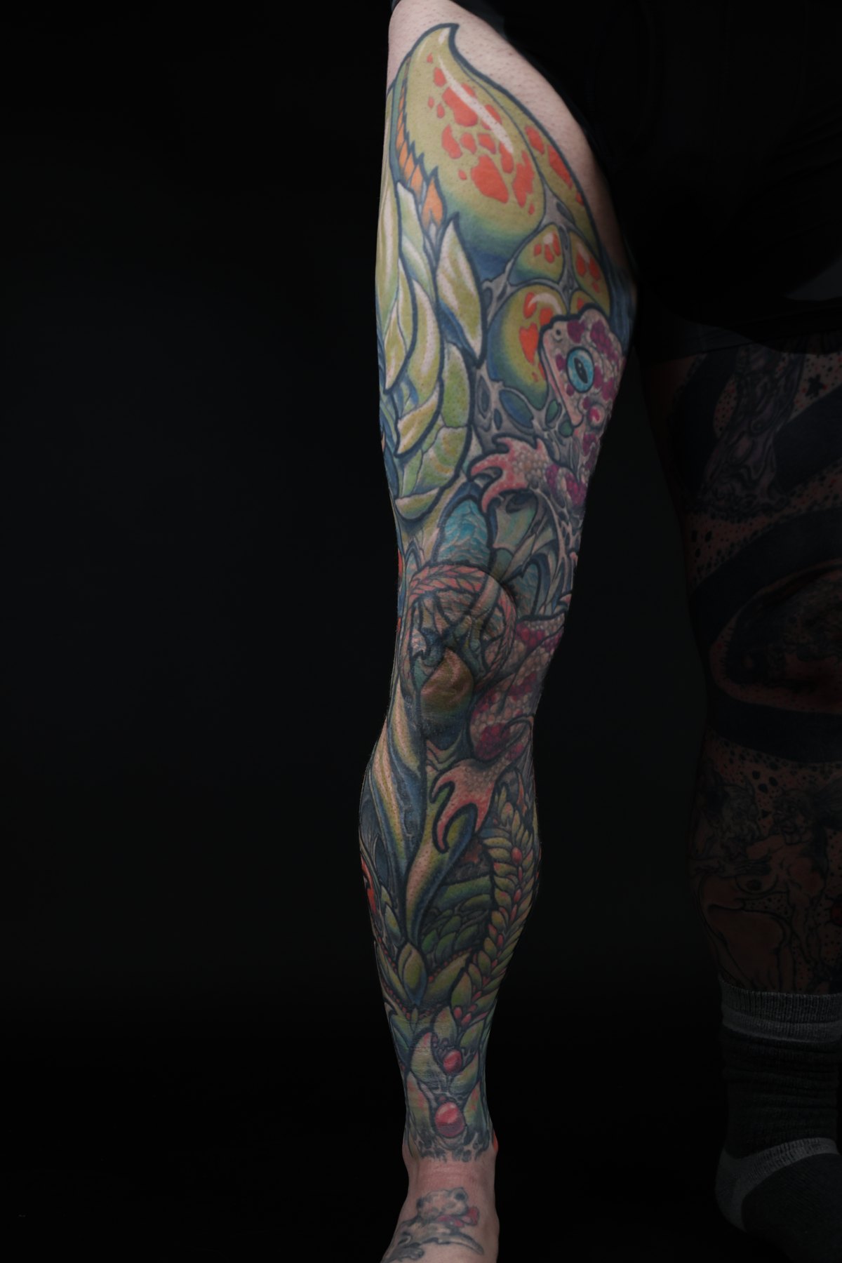Full-length color biomechanical leg tattoo by Josh Standley