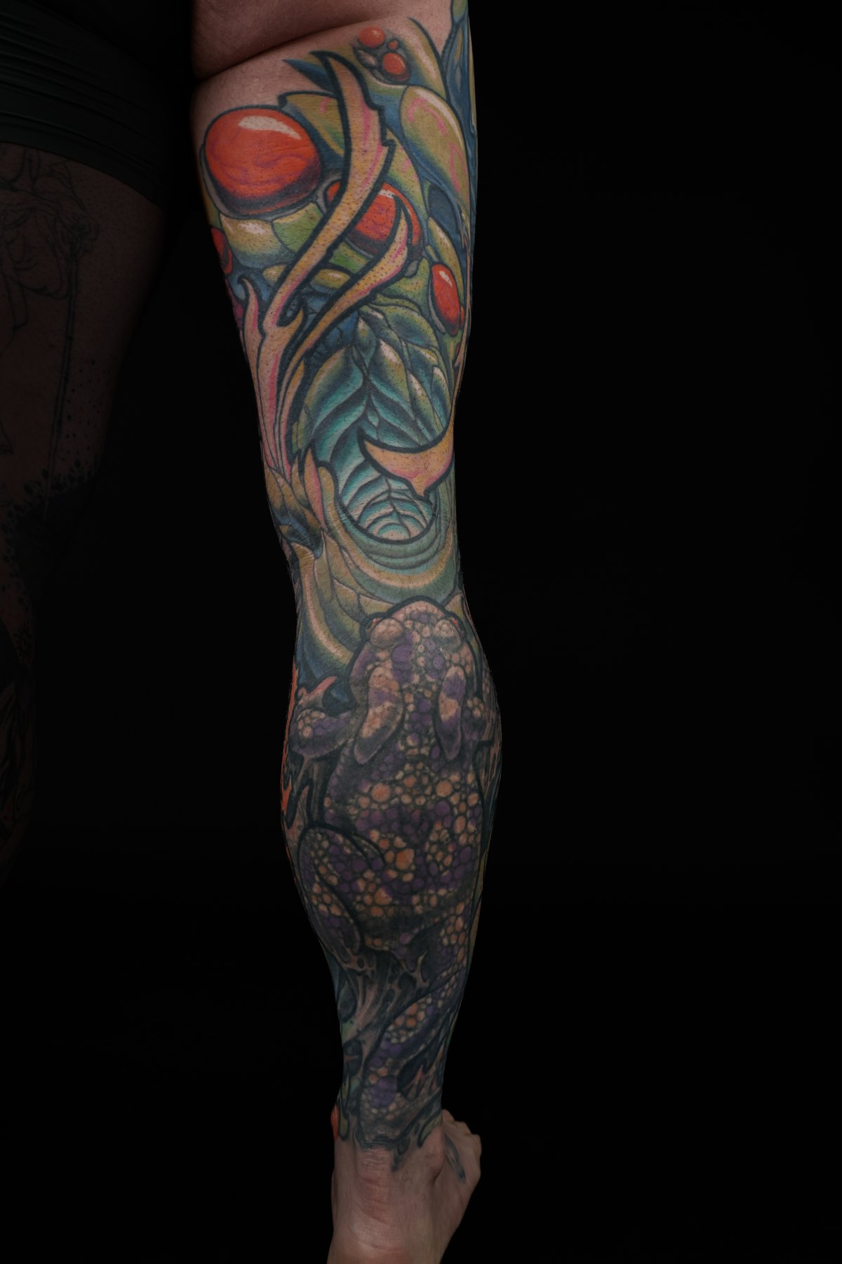 Color biomechanical thigh and leg tattoo by Josh Standley