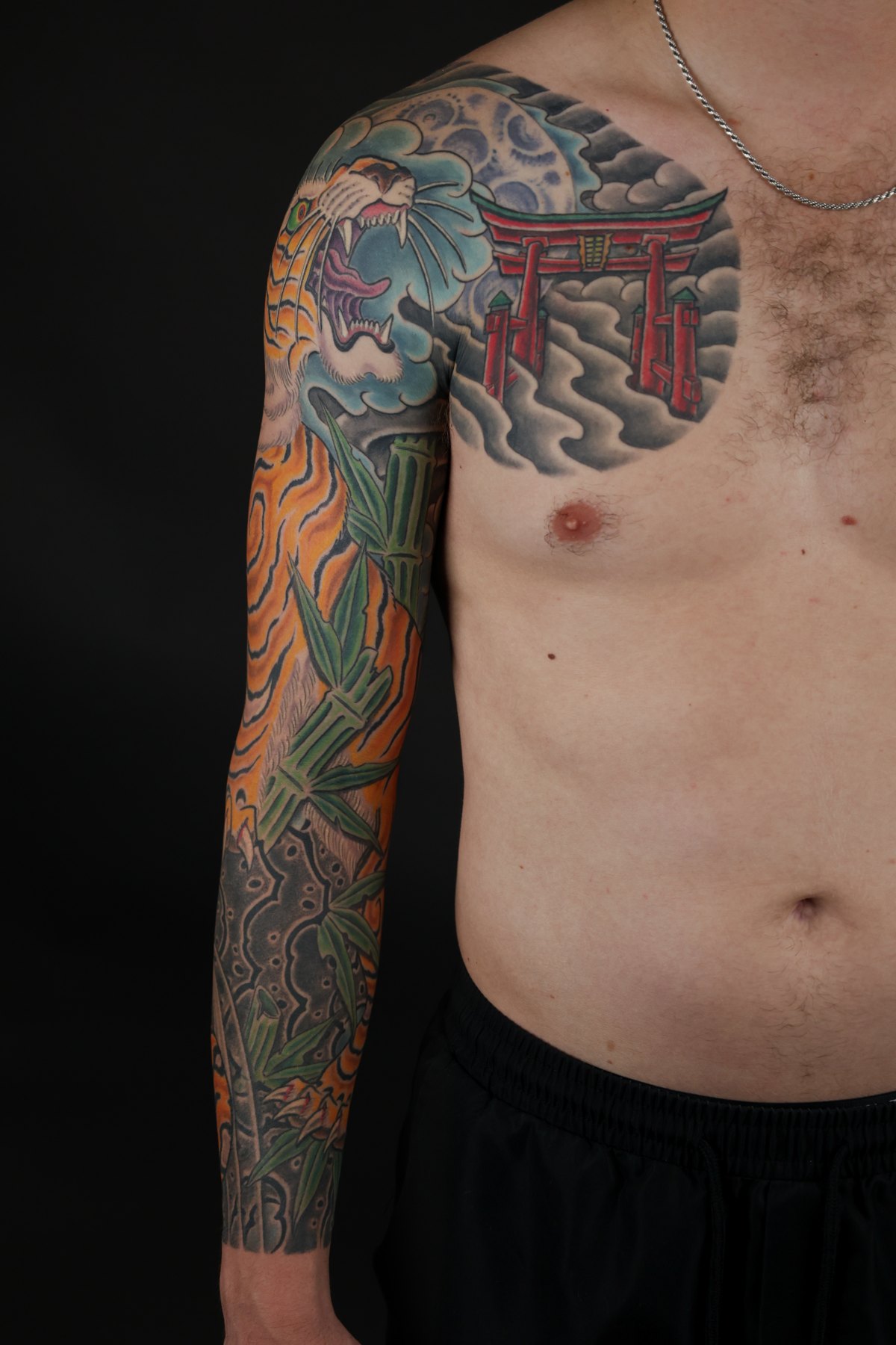 Japanese chest panel and full sleeve tattoo