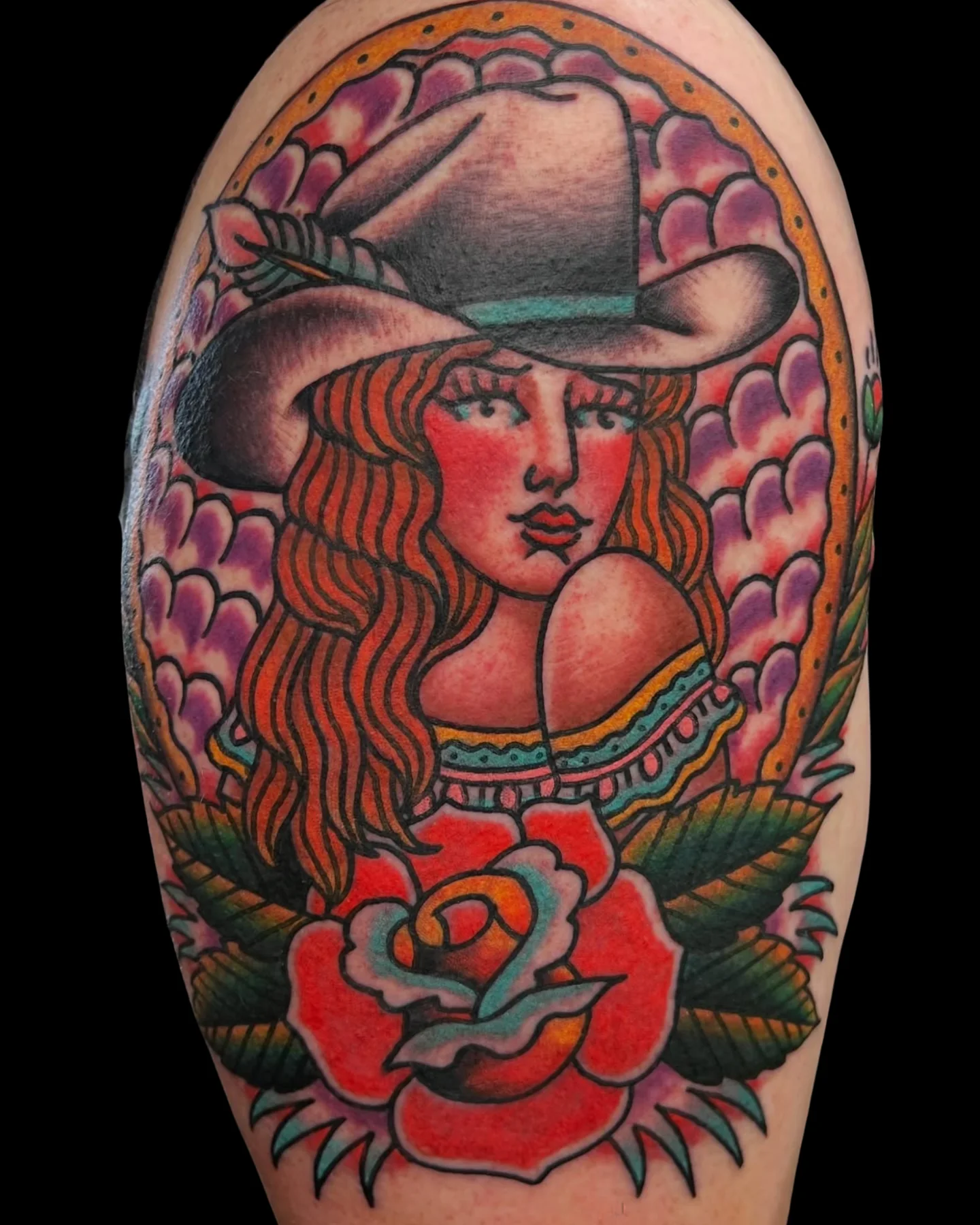 Traditional cowgirl portrait tattoo with a rose by Chris Harris