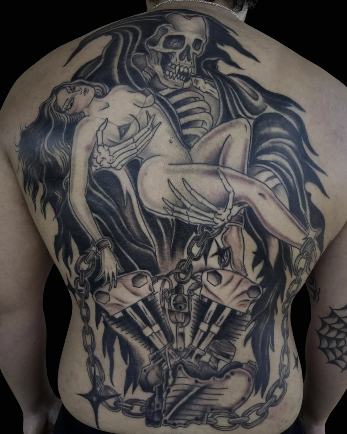 Black and grey full-back tattoo with skeletal figures by Justin Martinez