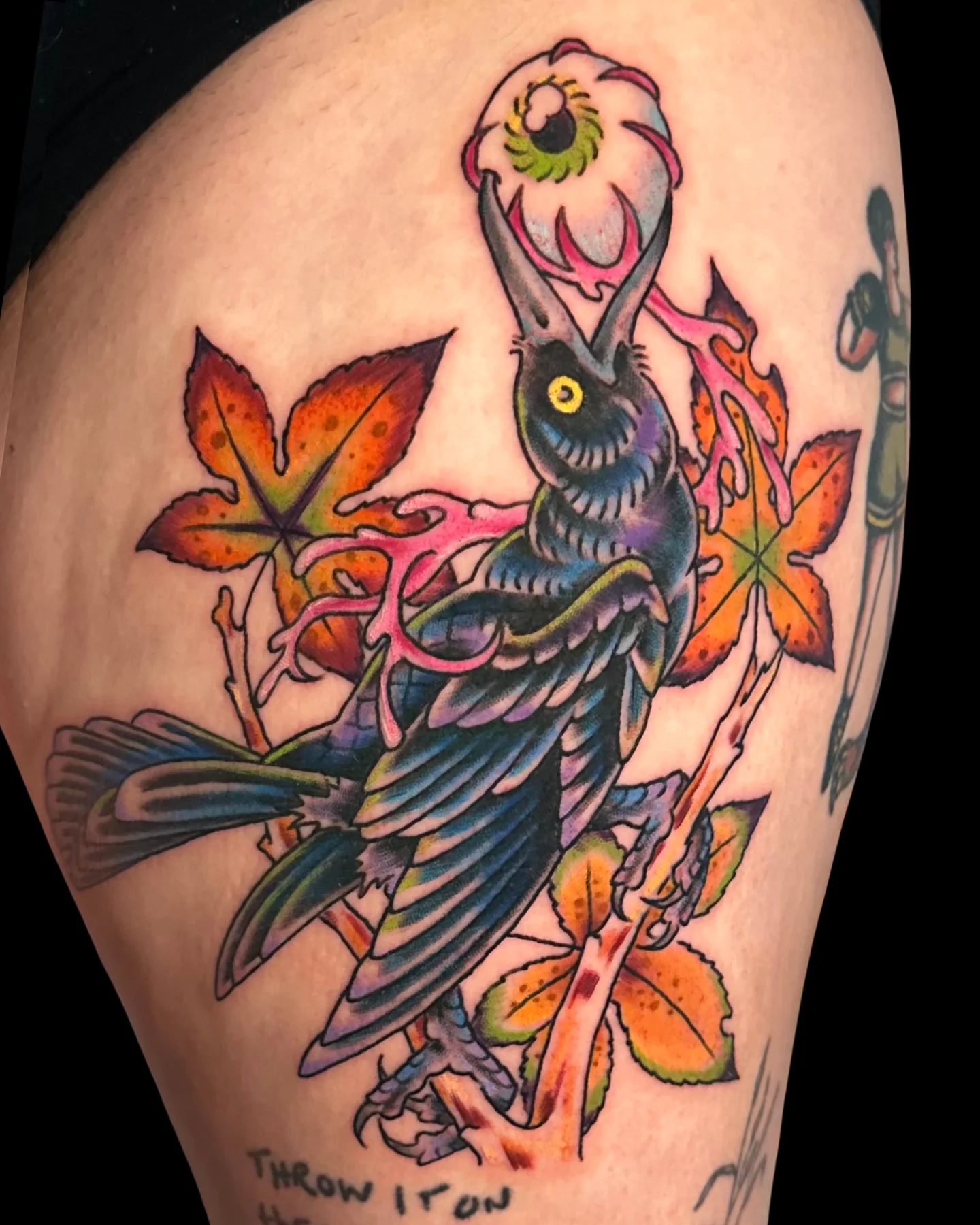 Color skeleton bird tattoo with orange flowers by Angel Serda
