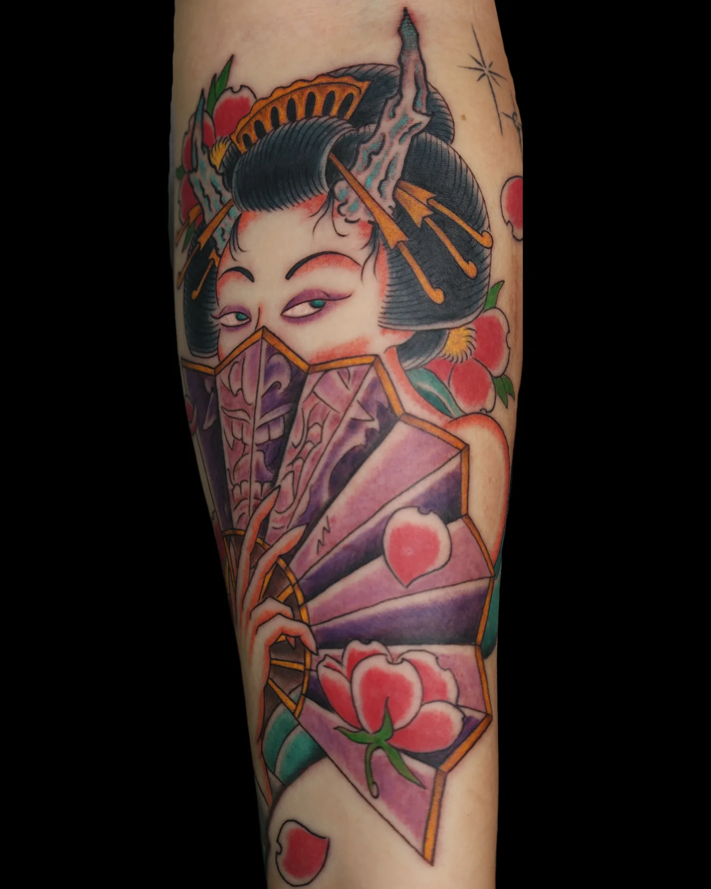 Color woman portrait tattoo with a fan and flowers by Angel Serda